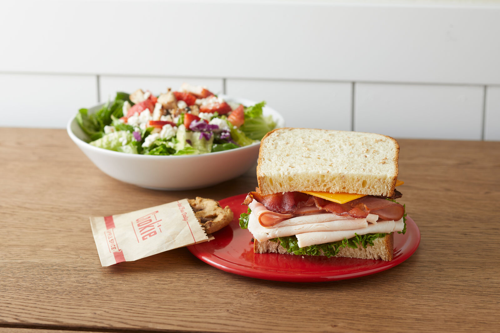 quick and easy box lunch catering with a sandwich, salad and cookie.